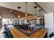 Elegant wet bar with counter seating, beverage cooler and stylish pendant lighting at 1750 Wewatta St # 805, Denver, CO 80202
