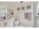 Modern bathroom with marble tile, a glass-enclosed shower, and a sleek vanity at 1750 Wewatta St # 805, Denver, CO 80202