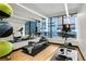 A modern fitness center with rowing machine, stationary bikes, and mirrored walls at 1750 Wewatta St # 805, Denver, CO 80202