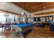 Resident game room with billiard table and lounging area with flat screen TV at 1750 Wewatta St # 805, Denver, CO 80202