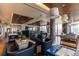 Community game room with billiards, foosball, and comfortable seating with skyline views at 1750 Wewatta St # 805, Denver, CO 80202