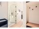 Bright hallway featuring hardwood floors, built-in storage, and access to a walk-in closet at 1750 Wewatta St # 805, Denver, CO 80202
