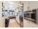 Bright, modern kitchen with stainless steel appliances and adjacent bedroom with a view at 1750 Wewatta St # 805, Denver, CO 80202