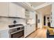 Modern kitchen features stainless steel appliances, bright white cabinetry, and sleek countertop at 1750 Wewatta St # 805, Denver, CO 80202