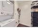 A compact laundry area with a stacked washer and dryer to maximize space and efficiency at 1750 Wewatta St # 805, Denver, CO 80202