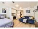 Open-concept living space featuring a modern kitchen and cozy living area at 1750 Wewatta St # 805, Denver, CO 80202