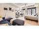 Cozy living room featuring modern furnishings, hardwood floors, and large windows with a view of the city at 1750 Wewatta St # 805, Denver, CO 80202