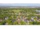 Aerial view of a neighborhood near a park showing lush greenery and residential houses at 869 S Williams St, Denver, CO 80209
