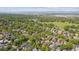 Aerial view of a neighborhood near a lake showing lush greenery and residential houses at 869 S Williams St, Denver, CO 80209