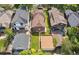 Aerial view of a backyard with a home, detached garage, and lush greenery, showcasing outdoor living at 869 S Williams St, Denver, CO 80209