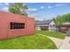 View of the backyard with a detached building on a green lawn, creating a serene and private outdoor space at 869 S Williams St, Denver, CO 80209