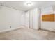 A basement featuring carpeted floors, white walls, and convenient built-in storage at 869 S Williams St, Denver, CO 80209