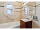 Functional bathroom with a tiled walls, and a vanity with storage at 869 S Williams St, Denver, CO 80209