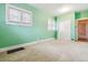 Inviting bedroom with a closet, three large windows, and neutral walls at 869 S Williams St, Denver, CO 80209