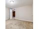 A clean bedroom with carpeted floors and white walls, featuring doorways and closet at 869 S Williams St, Denver, CO 80209