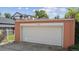 View of a detached garage with an automatic door, improving the property's convenience at 869 S Williams St, Denver, CO 80209