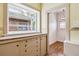 Kitchen that leads to a small room with a large window at 869 S Williams St, Denver, CO 80209