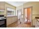 Charming kitchen featuring classic cabinets, modern appliances, and plenty of natural light at 869 S Williams St, Denver, CO 80209