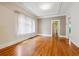 Inviting living room featuring hardwood floors, a large window, and neutral color scheme at 869 S Williams St, Denver, CO 80209