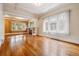 Bright and airy living room featuring hardwood floors, large windows, and coffered ceilings at 869 S Williams St, Denver, CO 80209