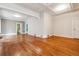 Open concept living room with hardwood floors and coffered ceiling, offering ample space at 869 S Williams St, Denver, CO 80209