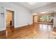 Spacious living room showcasing hardwood floors, an adjoining bathroom, and abundant natural light at 869 S Williams St, Denver, CO 80209