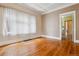 Bright living room with hardwood floors, natural light, and classic architectural trim details at 869 S Williams St, Denver, CO 80209