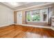 Bright living room featuring hardwood floors, large windows, and neutral wall paint at 869 S Williams St, Denver, CO 80209
