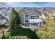 Beautiful backyard featuring a patio, pergola, well-maintained lawn and landscaping at 6802 Poppy Ct, Arvada, CO 80007