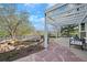 Landscaped backyard with pergola and koi pond overlooking pond at 6802 Poppy Ct, Arvada, CO 80007