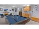 Finished basement featuring a billiards table, wet bar, and entertainment area at 6802 Poppy Ct, Arvada, CO 80007