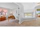 Upstairs landing with view of bedroom, desk and chair at 6802 Poppy Ct, Arvada, CO 80007