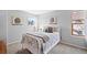 Bright bedroom with stylish bedding, decor, and natural light at 6802 Poppy Ct, Arvada, CO 80007