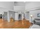 Spacious entryway with hardwood floors, staircase, and grey accent wall at 6802 Poppy Ct, Arvada, CO 80007