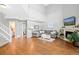 Spacious living room with hardwood floors, fireplace, and vaulted ceiling at 6802 Poppy Ct, Arvada, CO 80007