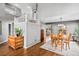 Open-concept living space with hardwood floors, neutral walls, and lots of light at 6802 Poppy Ct, Arvada, CO 80007