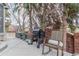 Backyard patio featuring a smoker, outdoor seating, and a charming rocking chair at 9208 W 100Th Pl, Broomfield, CO 80021