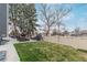 Spacious backyard featuring an outdoor seating area, grill, green grass and a privacy fence at 9208 W 100Th Pl, Broomfield, CO 80021