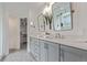 Bathroom featuring double vanity, modern fixtures, and a glass shower enclosure at 9208 W 100Th Pl, Broomfield, CO 80021
