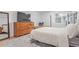 Bedroom with light walls, neutral carpet, a large window, and wood furniture at 9208 W 100Th Pl, Broomfield, CO 80021