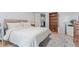 Neutral bedroom featuring a queen-sized bed, light-colored walls, and light-colored carpeting at 9208 W 100Th Pl, Broomfield, CO 80021