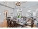 Open-concept dining room with elegant decor, a large table, and abundant natural light at 9208 W 100Th Pl, Broomfield, CO 80021