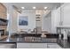 Modern kitchen featuring granite countertops, stainless steel appliances, and breakfast bar seating at 9208 W 100Th Pl, Broomfield, CO 80021