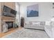 Comfortable living room with a brick fireplace, plush seating, and stylish decor at 9208 W 100Th Pl, Broomfield, CO 80021