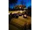 Cozy patio with a fire pit, outdoor seating, and soft lighting for an inviting evening ambiance at 9208 W 100Th Pl, Broomfield, CO 80021