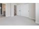 Spacious bedroom featuring a large closet and access to a bathroom and stairs at 888 S Valentia St # 104, Denver, CO 80247