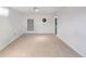 Spacious basement with carpet flooring, natural light from a small window, and white walls at 6167 Newland St, Arvada, CO 80003