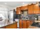 Well-equipped kitchen featuring granite countertops and stainless steel appliances at 6167 Newland St, Arvada, CO 80003