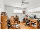 Bright home office with hardwood floors, two windows, and plenty of storage space at 6167 Newland St, Arvada, CO 80003