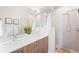 Modern bathroom featuring a double sink vanity and a glass-enclosed shower at 1836 Grove St # 105, Denver, CO 80204
